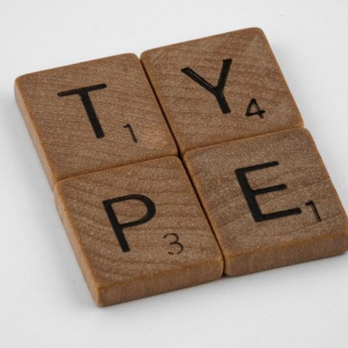 scrabble, scrabble pieces, lettering, letters, wood, scrabble tiles, white background, words, type, typography, design, layout,